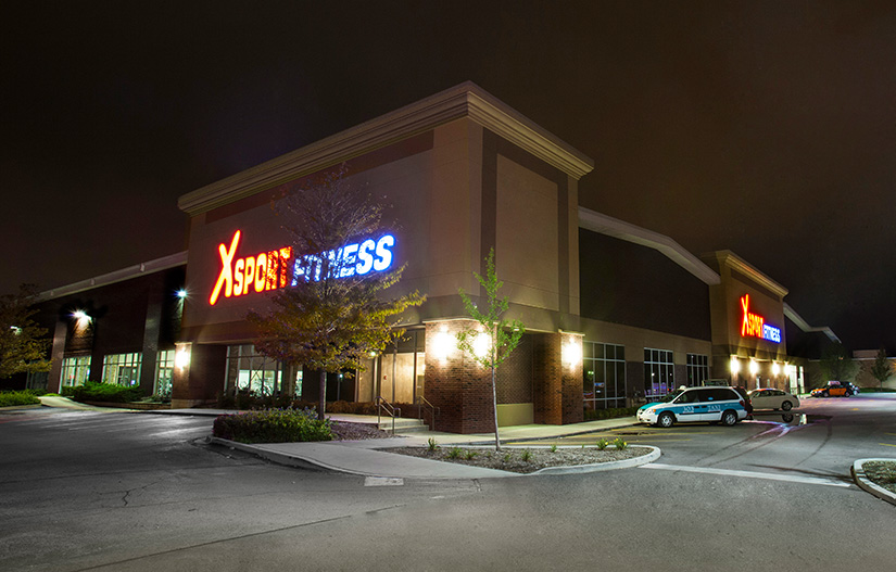 XSport Fitness exterior of building at night