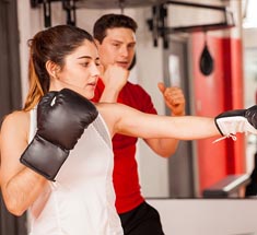 woman taking boxing class
