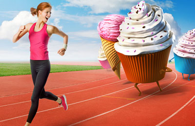woman running away from cupcakes