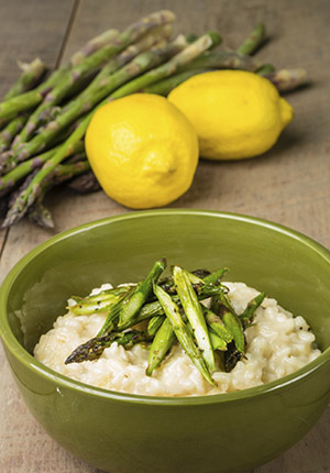 bowl of grains with veggies and lemon