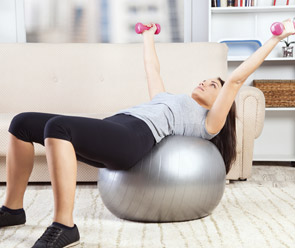 woman exercising on a stability ball